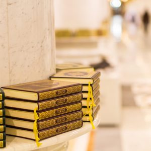 Give a Quran in Makkah or Madinah